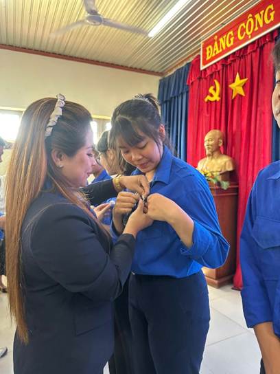 ''A person tying a bracelet on a child's wrist

AI-generated content may be incorrect.''